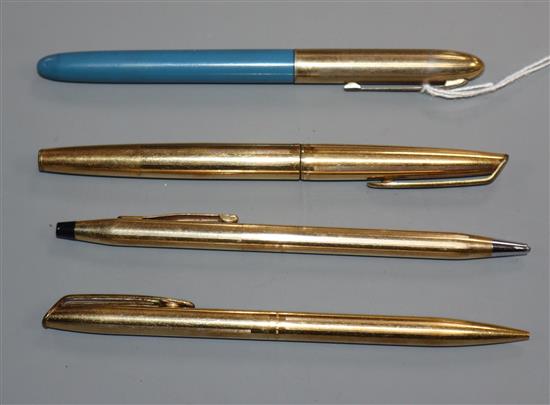 Two gold Waterman pens and two others